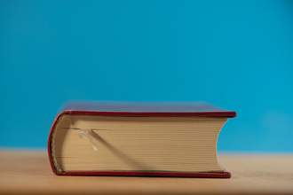 large hardcover book on table