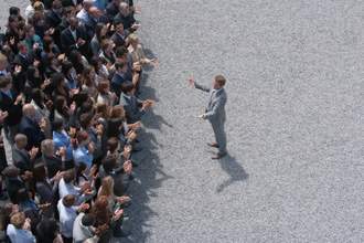 large-group-of-people-applaud-speaker