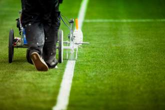 line being painted on football field