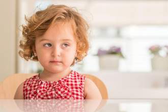 little girl judging someone off to the side