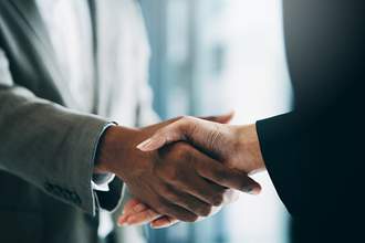 man and woman shaking hands