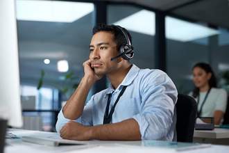 man at work stares blankly at computer