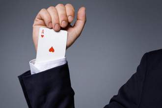 man is hiding an ace in the sleeve