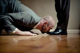 man kissing the top of someones shoes