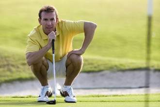 man looking focused while trying to gauge his next swing