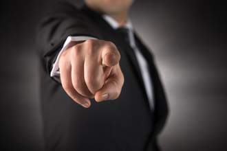 man pointing finger straight at camera