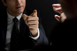 man pointing finger threateningly