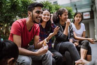 man telling joke to his friends