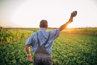 man waving baseball cap