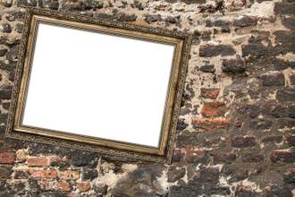 metal frame hanging askew on a brick wall