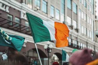 national flag of ireland close-up above people crowd