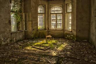 old wood chair in an abandoned and dilapidated house