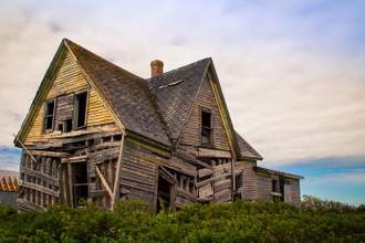 old wooden home that is falling apart