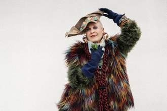 older lady wearing a gorgeous over the top outfit