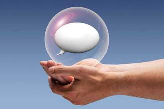 pair of hands holding a speech bubble