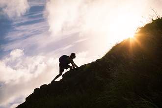 person climbing hill
