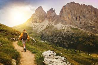 person hiking through a gorgeous mountain range