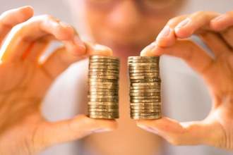 person holding a stack of coins in both hands