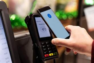 person paying with their phone