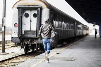 person running towards a train