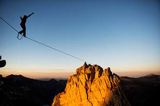 person walking a tight rope