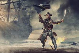 pirate on beach holding flag and cutlass near his pirate ship