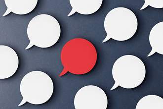 red speech bubble surrounded by white ones