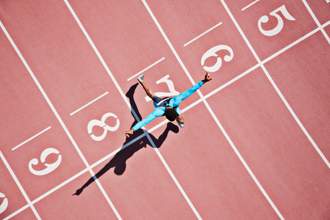 runner crosses the finish line