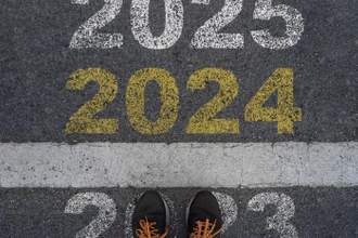running shoes standing on 2023 getting ready to cross the finish line into 2024 and the future