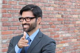 salesman pointing at camera and smiling