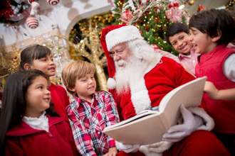 santa reading to the children
