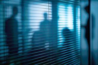 shadowy group meeting behind blinds