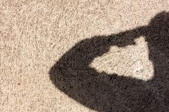 silhouette of person saluting