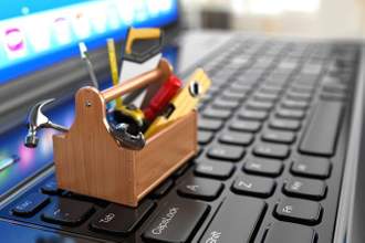 small toolbox sitting on top of computer keyboard