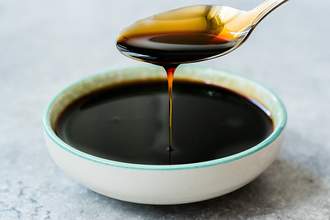 spoon pouring molasses