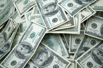 spread out stack of one hundred dollar bills