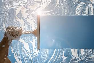 squeegee cleaning window