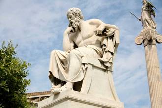 statue of socrates the philosopher with sky in distance