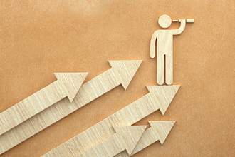 stick figure person on top of arrows pointing up