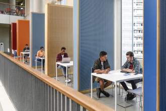 students working in modern study cubicles
