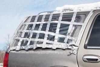 taped up back window of sports utility vehicle