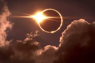 the moon covering the sun in a solar eclipse