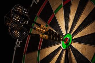three darts in a bullseye