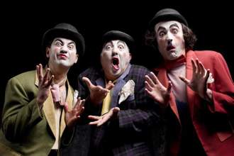 three mimes looking crazily at the camera
