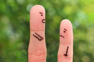 two fingers concept of man scolding another person