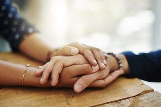 two people holding hands