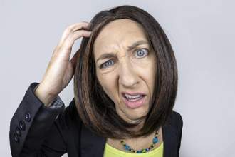 up close shot of a woman looking confused scratching her head