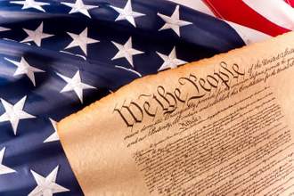 us constitution - we the people sitting on an american flag
