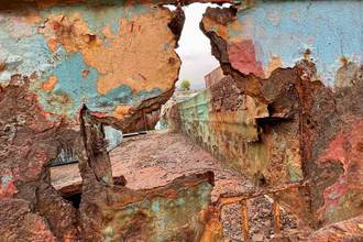 view through a corroded metal piece