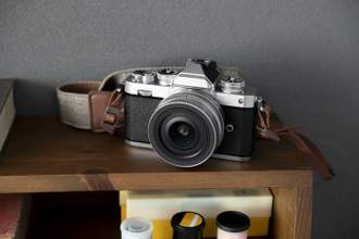 vintage film camera sitting on a shelf